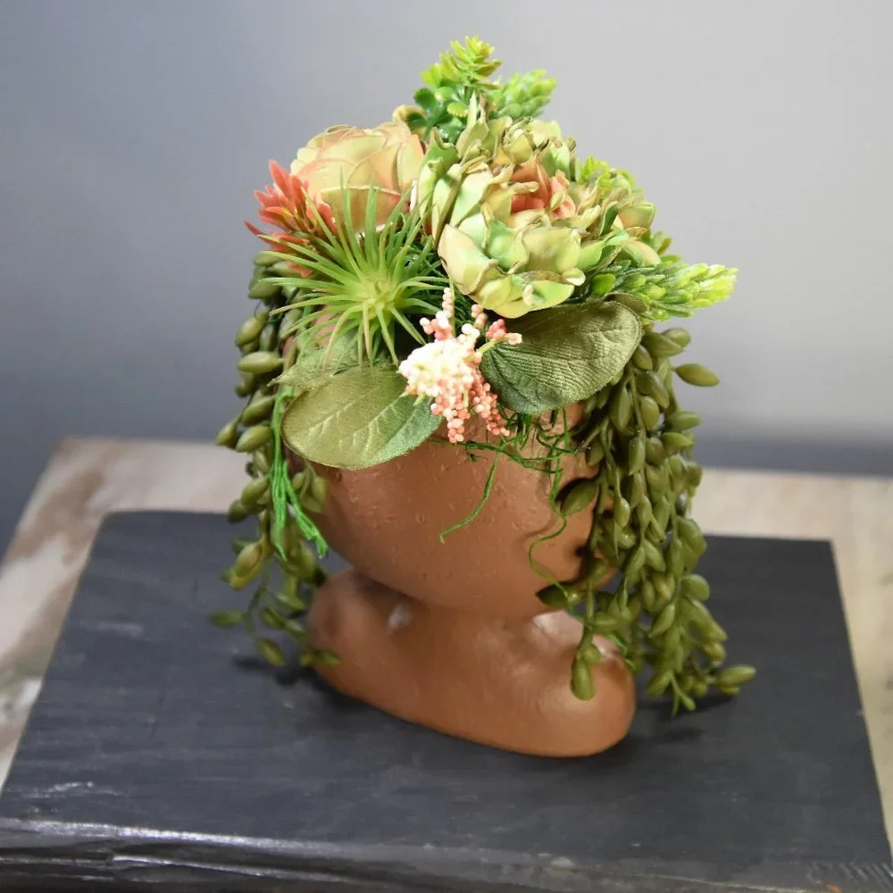 Serene, peaceful airbrushed Sola wood succulents in a fun fabulous face planter